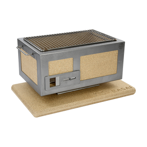 Kasai Konro BBQ Grill with Steel Frame V2 on cork base, showing side air vent and ceramic insulation for high-performance outdoor cooking.
