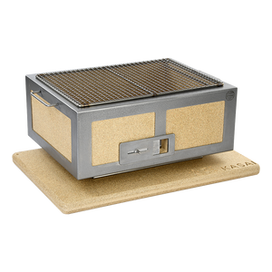 Medium Kasai Konro Grill with stainless steel frame and ceramic sides placed on branded heatproof mat, suited for compact outdoor cooking setups.
