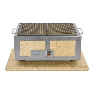 Front-facing Kasai Konro BBQ Grill - Medium with stainless steel frame on branded mat, showcasing its compact and durable grilling design.