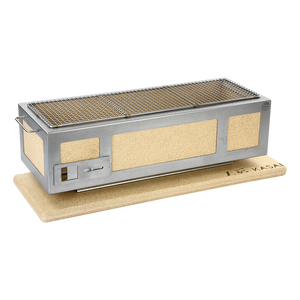 Angled view of the Long Kasai Konro Grill with Stainless Steel Frame V3 on a cork base, great for outdoor kitchen setups.