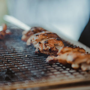 Grilled chicken skewers cooking evenly on a Kasai Konro Skewer Rack, showcasing the effectiveness of Kasai Konro Skewers in action.