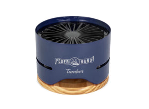 Feuerhand Tamber Table Top Grill in cobalt blue with lid used as base, showcasing its dual-purpose design for efficient outdoor grilling.
