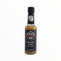 Tropical Flame hot sauce bottle with award badge