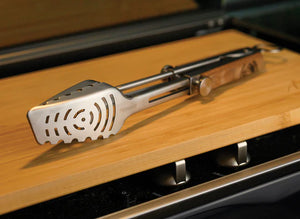 Petromax Telescopic Grill Tongs displayed on wooden countertop for grilling