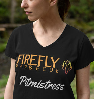 Close-up of Women's Pitmistress V Neck T Shirt in black, showcasing Firefly Barbecue branding on soft organic cotton fabric.