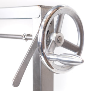 Close-up of Bertha Asado Grill Medium’s stainless steel hand crank for adjusting grill height with precision and ease.