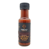 Front view of Firefly BBQ Reaver's Carolina Reaper Hot Sauce bottle with bold black and orange label. Spicy Carolina Reaper heat in 100ml glass bottle.