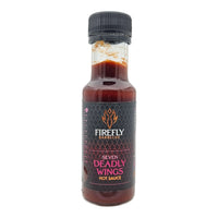 Black cap hot sauce bottle with red liquid inside
