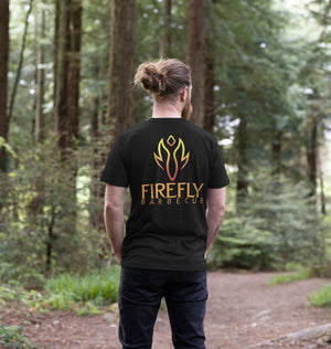 Back view of man in Mens Rub my Butt T-Shirt showing bold Firefly Barbecue logo, perfect for BBQ lovers and sustainable fashion fans.