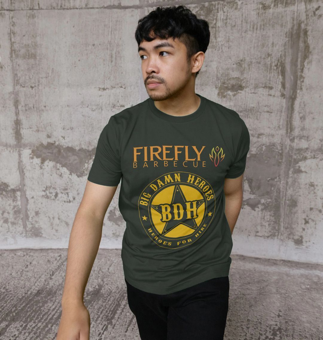 Model wearing dark green T-shirt with Firefly Big Damn Hero logo outdoors