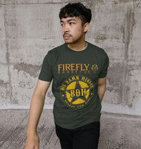 Model wearing dark green T-shirt with Firefly Big Damn Hero logo outdoors