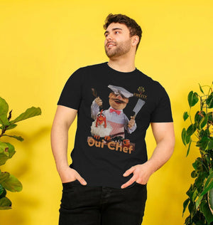 Model wearing Mens Swedish Chef T-shirt in black with bold chef design and 'Oui Chef' slogan, made from sustainable organic cotton.