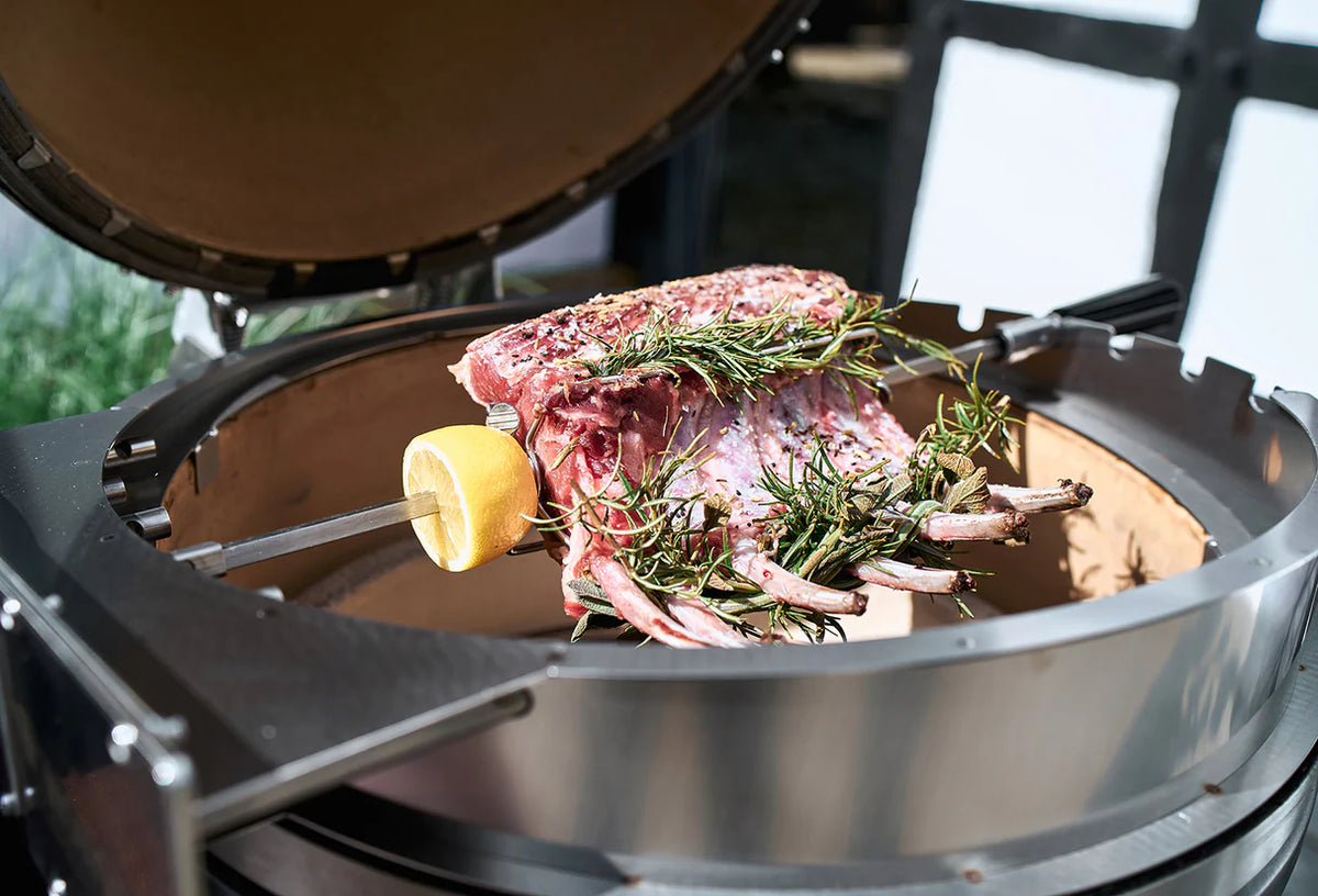 Raw meat with herbs on a grill