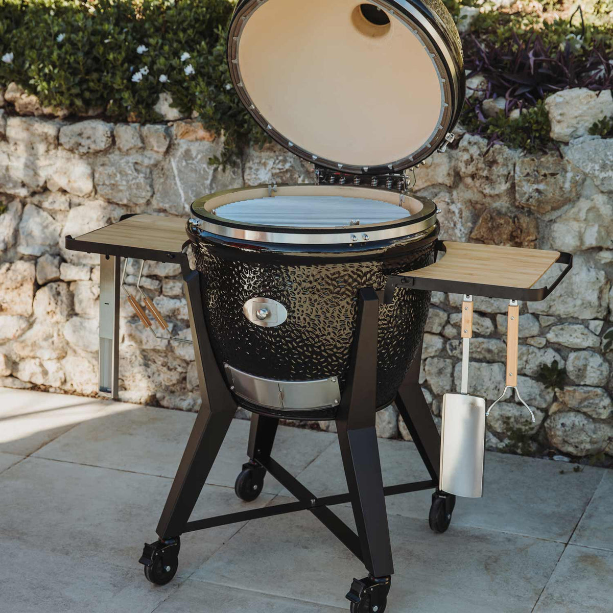 Kamado grill with side tables and wheels for outdoor cooking