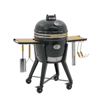Black Kamado Grill with side tables and adjustable vents for outdoor grilling