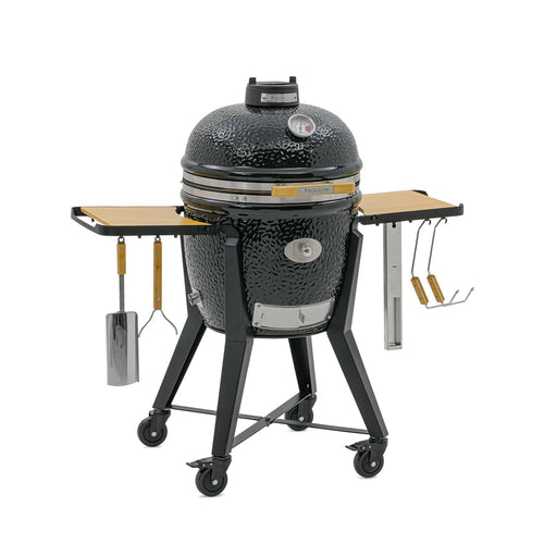 Black Kamado Grill with side tables and adjustable vents for outdoor grilling