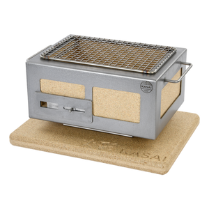 Compact Kasai Konro Grill Plancha - Solid Heat Mat Edition with ergonomic handles and heat mat, designed for precise and versatile outdoor cooking.