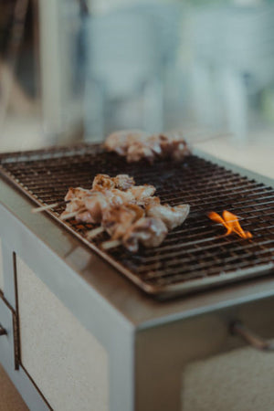 Close-up of grilled meat on Nano Pro Kasai BBQ Stainless Steel Grill, showcasing its performance and even heat distribution.