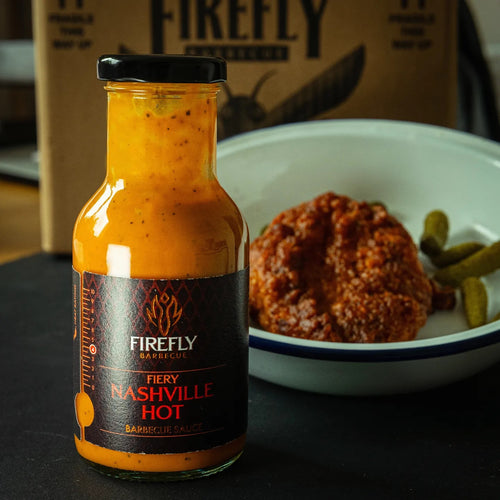 Nashville Hot BBQ Sauce bottle with food background