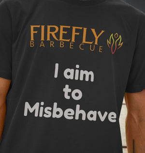 Close-up of Men's Misbehave T-Shirt - Firefly TV Show quote in white on black fabric, highlighting Firefly Barbecue logo and soft organic cotton texture.