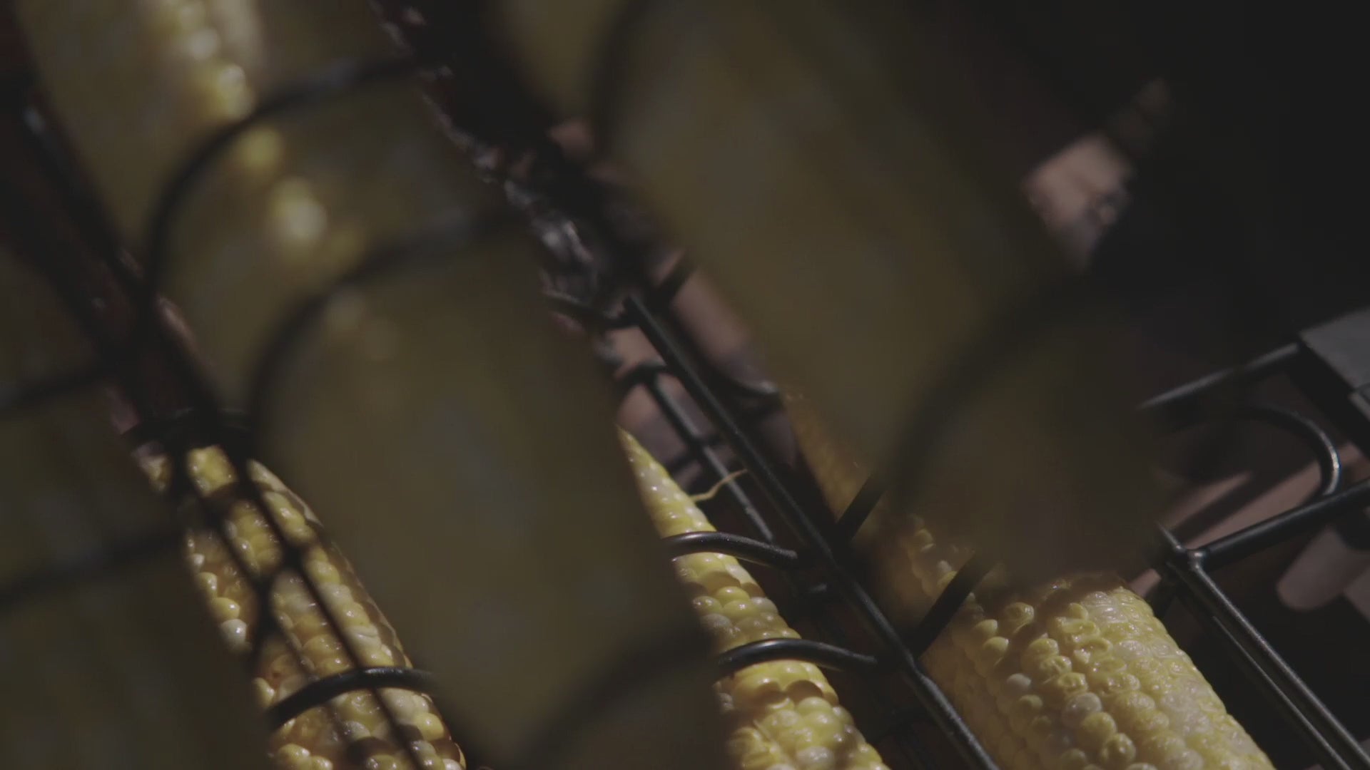 Close-up of corn grilling on Pit Barrel Corn Hanger