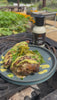 Alabama White BBQ Sauce bottle on outdoor table