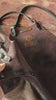 Leather apron with cross straps and logo detail