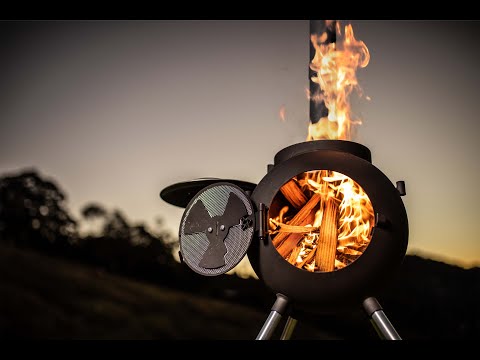 Ozpig Series 2 Portable Wood Fired BBQ Stove in action with visible flames, showcasing its efficient wood-burning design for outdoor use.