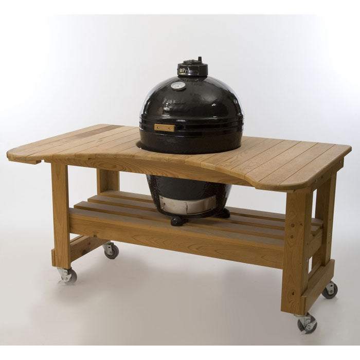 Primo Kamado Ceramic BBQ Grill mounted in a wooden outdoor table cart with storage shelf, perfect for backyard grilling setups.