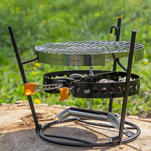 Petromax Grilling Grate in outdoor setting on Atago grill, perfect for charcoal or briquette grilling with durable stainless steel design.