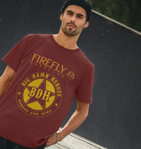Model in gray T-shirt with Firefly Big Damn Hero logo in urban setting
