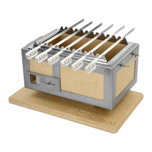 Kasai Konro Skewer Rack with six skewers on a Kasai grill, placed on a heat-resistant base. Premium outdoor grill accessory for skewering.