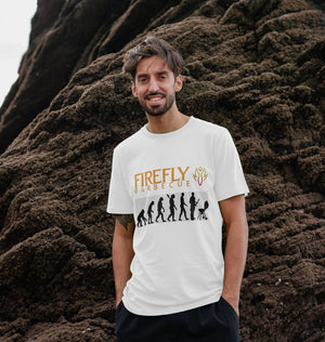 Man modeling white Mens Evolution of BBQ T-shirt with Firefly Barbecue design, perfect organic cotton apparel for BBQ enthusiasts.
