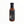 Close-up of sauce bottle with black cap and label