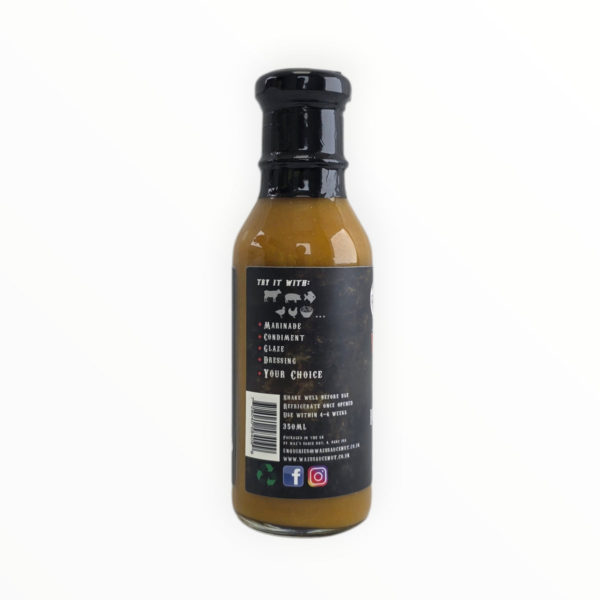 Bottle of Waz's Sauce Island Breeze Mango Sauce with awards