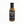 Black cap on mustard-colored sauce bottle