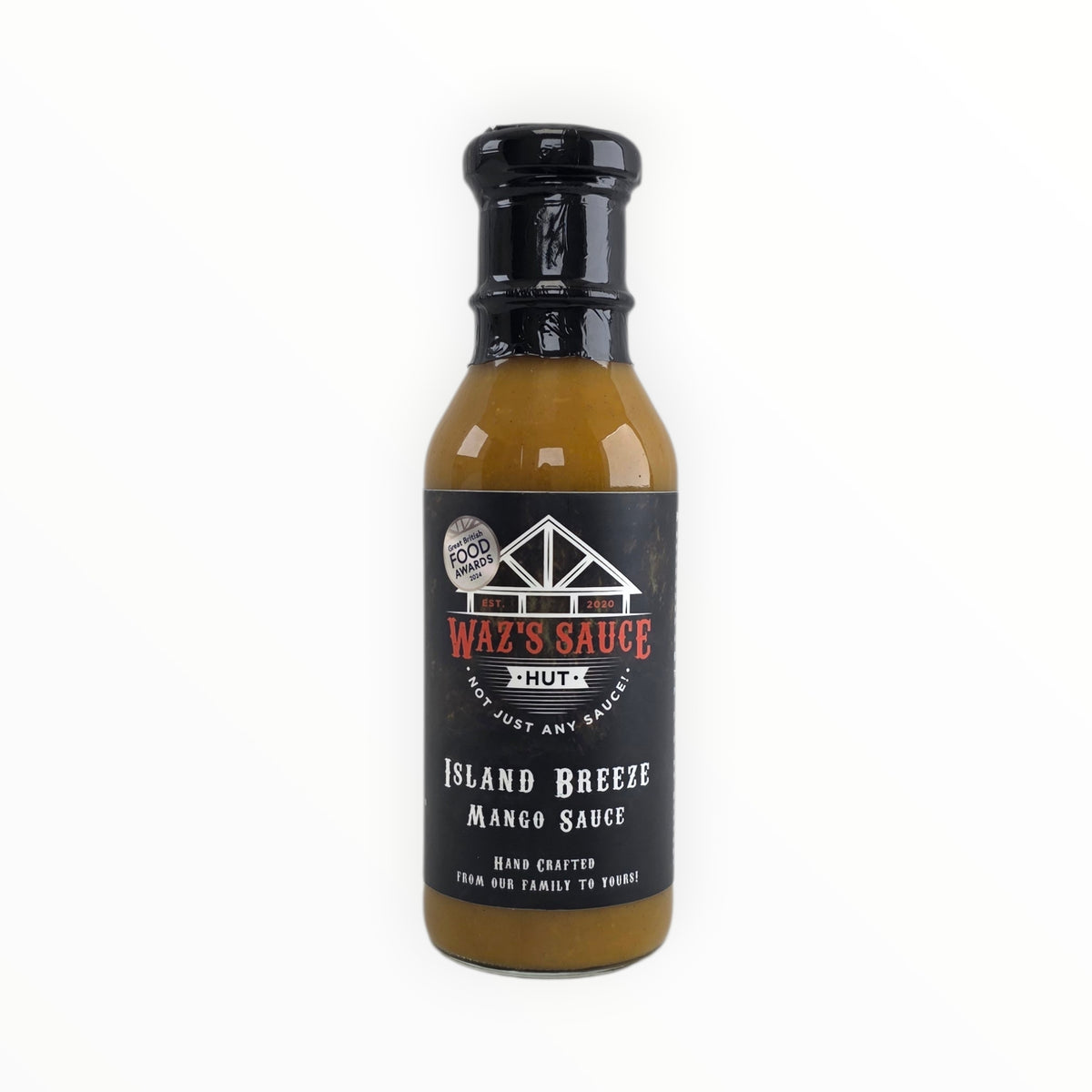 Black cap on mustard-colored sauce bottle