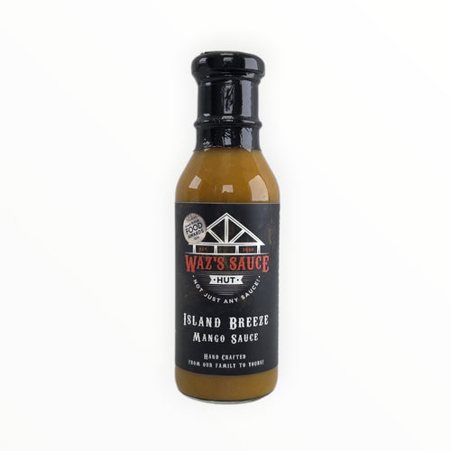 Black cap on mustard-colored sauce bottle