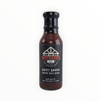 Sweet Embers Cherry Cola BBQ Sauce bottle with black cap
