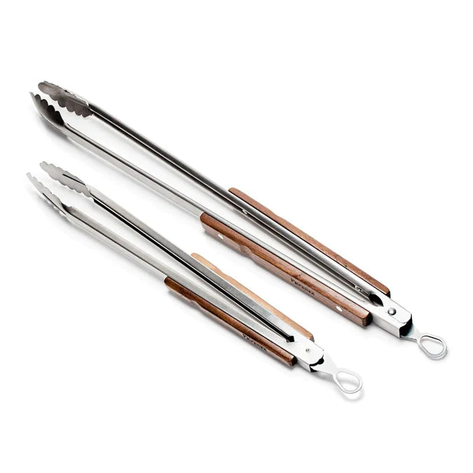 Set of stainless steel BBQ tongs with wooden handles for outdoor grilling