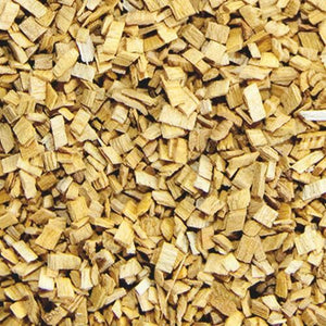 Close-up of Borniak Alder wood smoking chips showing fine, uniform texture ideal for cold smoking fish and meats on grills.