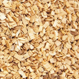 Close-up of Borniak Beech Wood Chips showing fine texture, ideal for adding mild smoky flavor to meats and cheeses during smoking.
