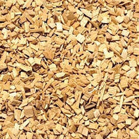Close-up of chopped cherry wood chips for smoking and grilling