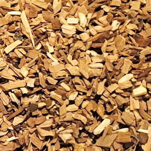 Detailed view of Borniak Plum wood chips texture, showcasing the fine cut ideal for cold smoking and enhancing barbecue flavors.