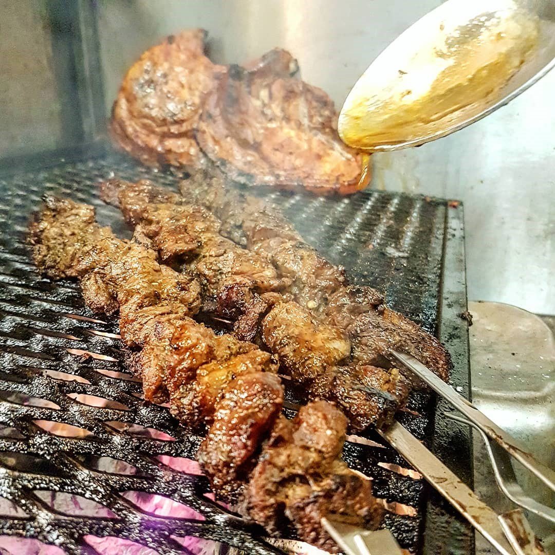 Meat grilling with jerk seasoning