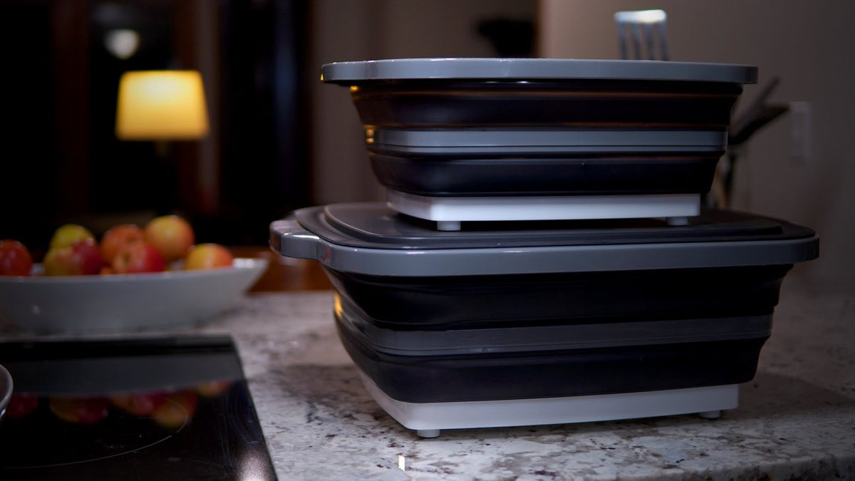 Stacked collapsible BBQ prep tubs with lids for outdoor grilling and food storage