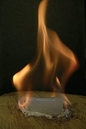 Burning firelighter block on surface