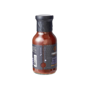 Angled view of Firefly Black Truffle BBQ Sauce bottle highlighting label design and premium packaging for upscale barbecue sauces.