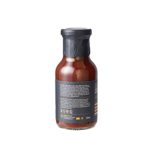 Back label of California Apple BBQ Sauce bottle highlighting ingredients and usage notes, ideal for food and condiments shoppers.