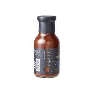 Side view of Firefly BBQ Kansas Brisket BBQ Sauce bottle showing spice level indicator and sleek black label design for gourmet grilling.